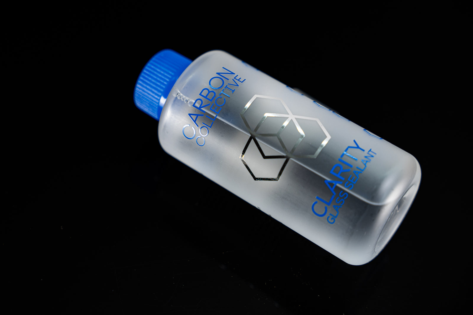 Carbon Collective Clarity Glass Sealant with Cobalt Blue Bottle Cap Blue Text