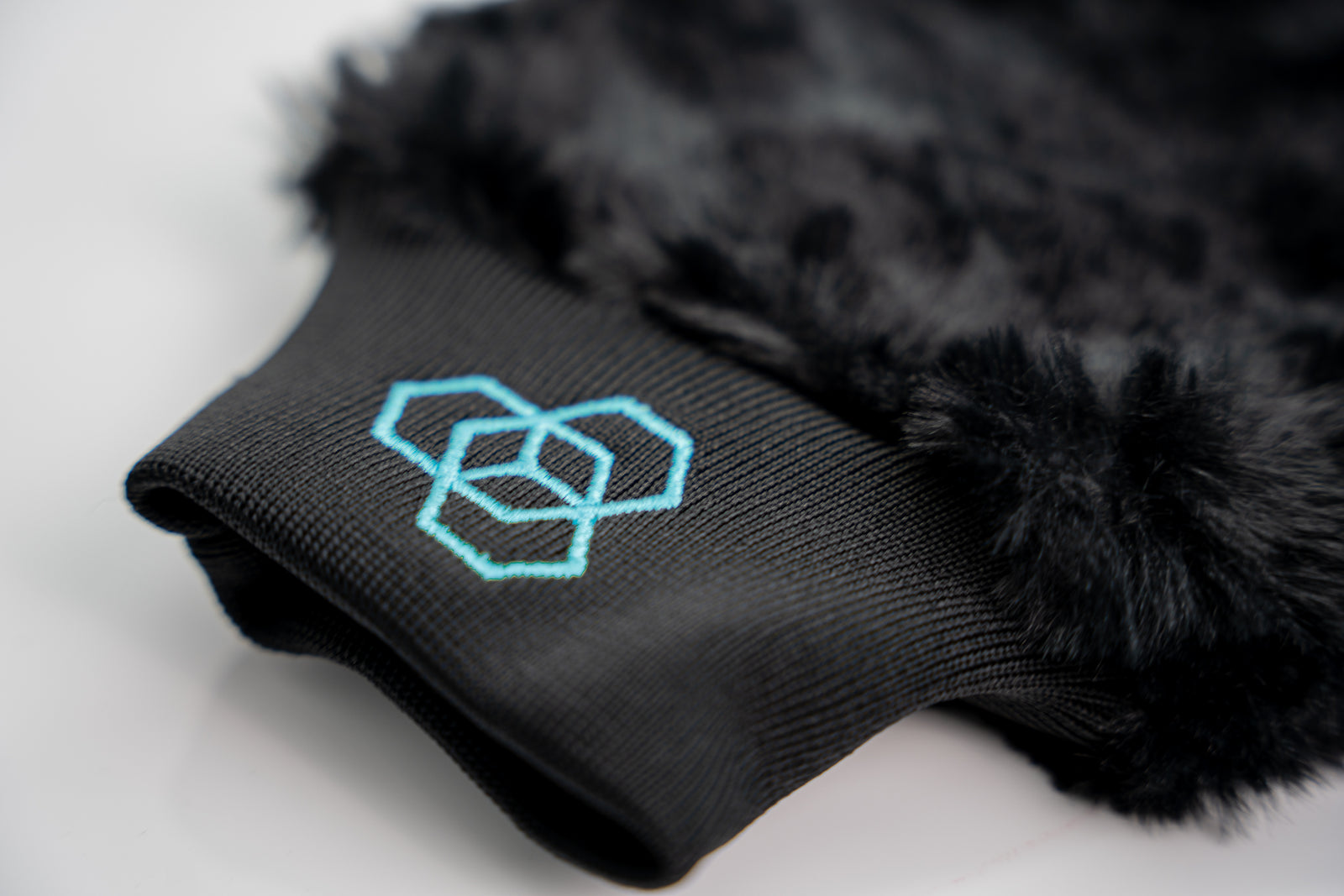 Carbon Collective Supreme Plush Wash Mitt made from ultra-soft microfiber with 800GSM, designed to safely lift dirt and restore sheeting and beading properties on protected surfaces. Features a slim design and interior finger pockets for hard-to-reach areas.