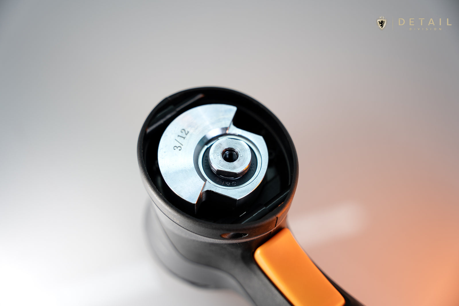 Close-up of a car detailing tool with a blurred background