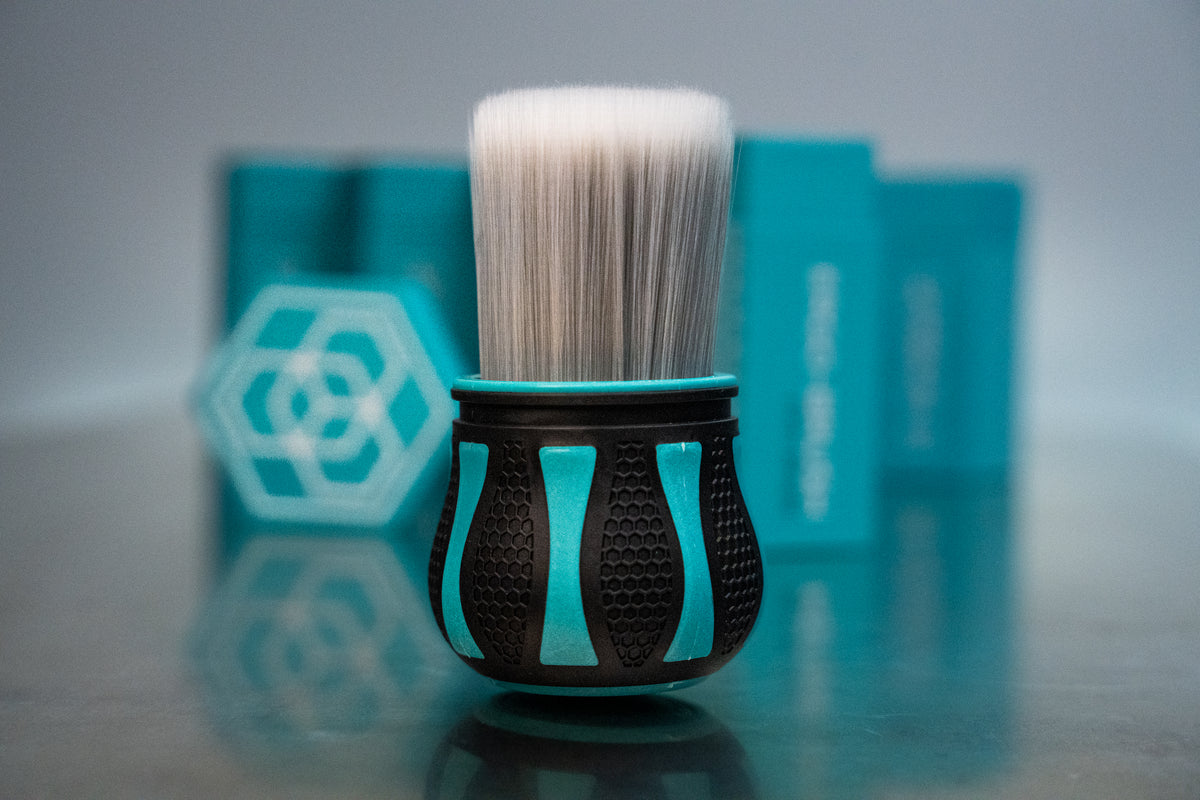 Carbon Collective Firm Bristle Ergo Detailing Brush with soft-tipped firm bristles and a non-slip hexagonal grip. Safe for interior and exterior surfaces, wheels, and crevices, usable wet or dry.