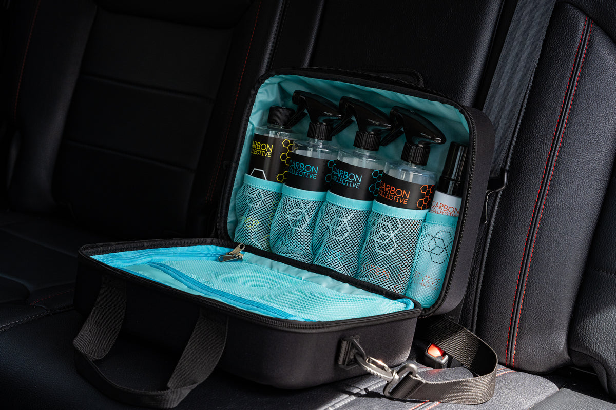  Carbon Collective Hard Case Detailing Carry Case (2025 Edition) with rugged EVA foam shell, storage for five 500ml bottles, microfiber towels, and accessories. Includes mesh and zippered pockets, padded handle, and limited edition Teal option.