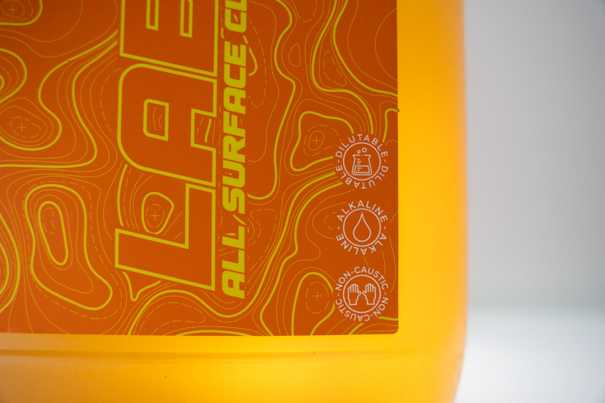 LABS All Surface Cleaner Macro Shot Indicating Dilutable, Alkaline, Non-Caustic Orange Front Label Yellow Text 5L Jug