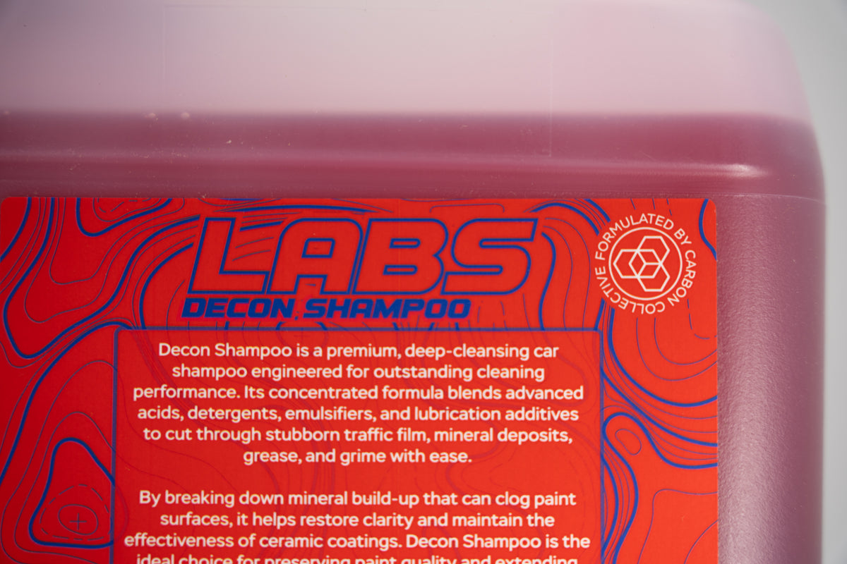 Macro Image LABS Decon Shampoo 'Formulated by Carbon Collective' with partial macro use text for auto detailing decon soap